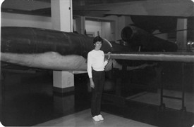 Photo:Gordon Jones's daughter Glynis standing next to a Doodlebug at the Canberra War Museum